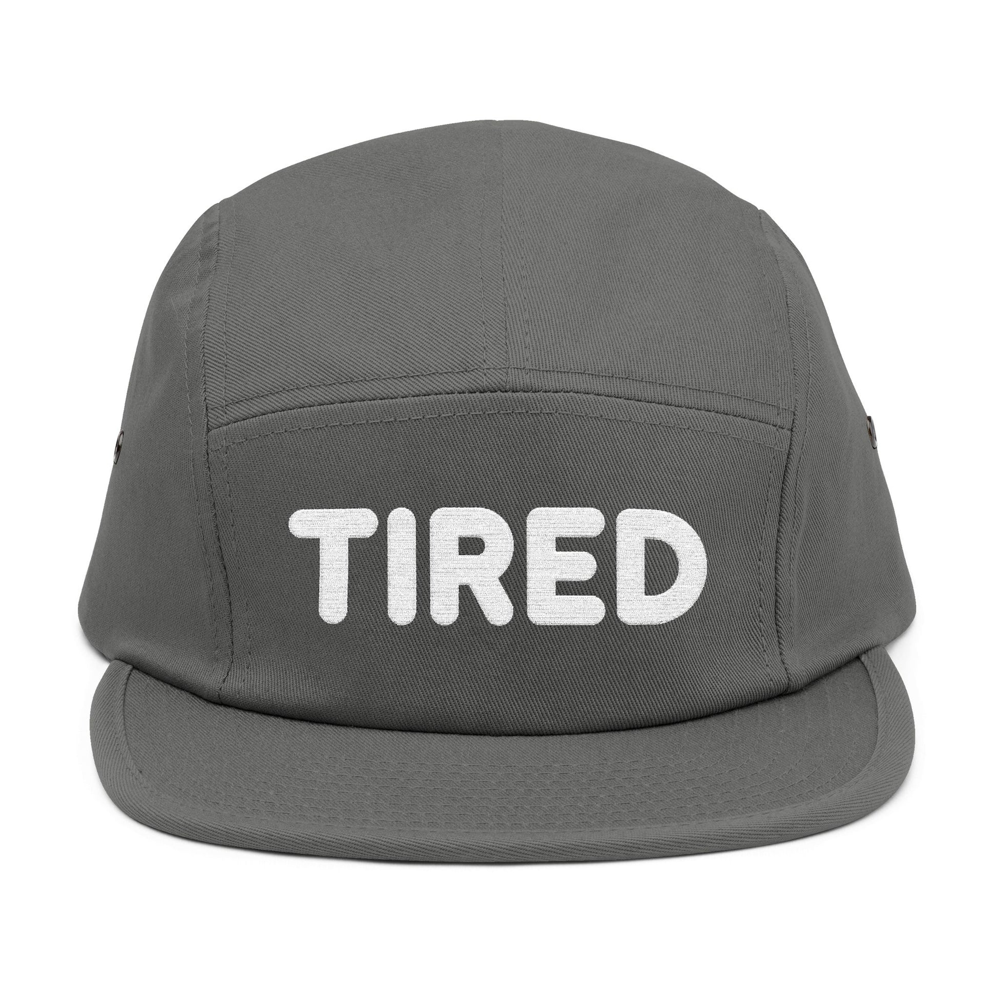 Gray cap with 'TIRED' text on a white background. TIRED minimalist text embroidered on 5-panel cap by TEEZOCA