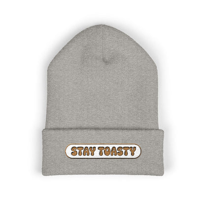 Gray beanie with 'Stay Toasty' text on a white background