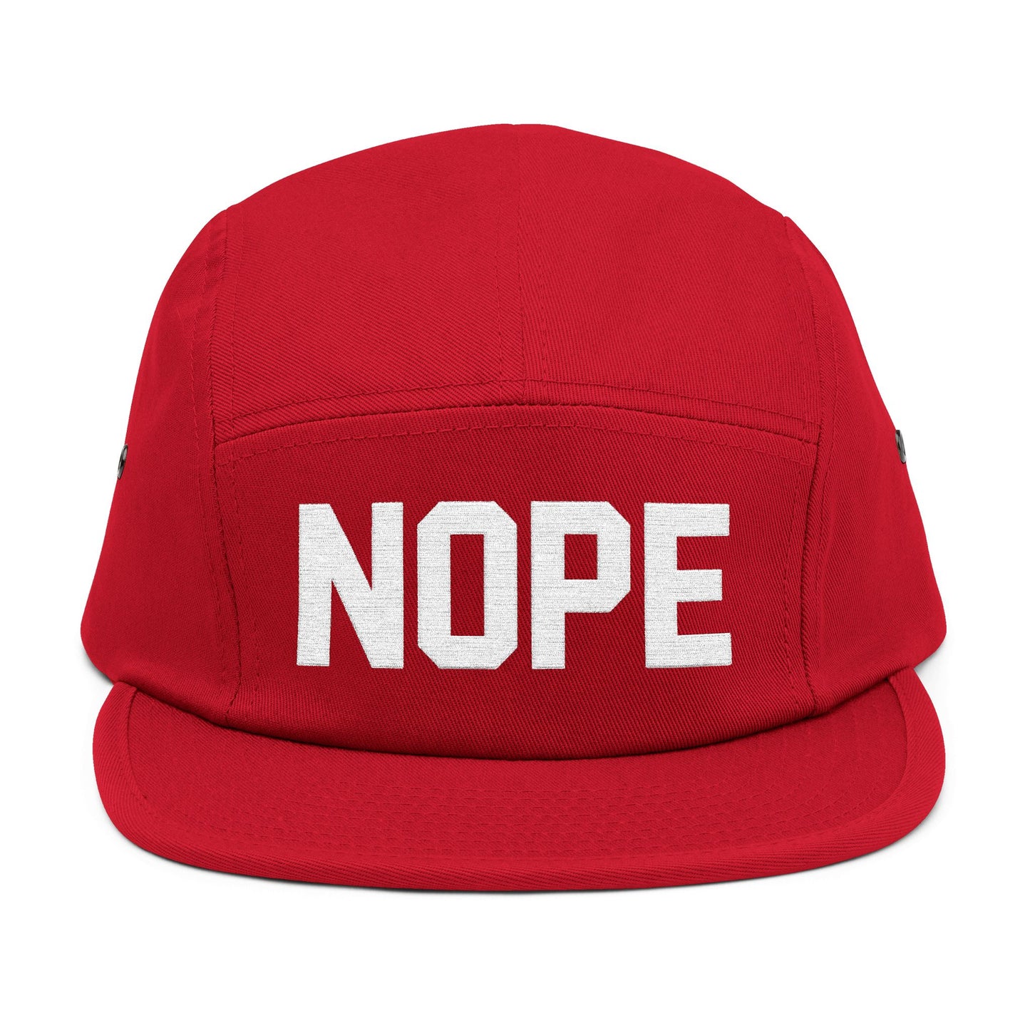 Red cap with 'NOPE' text on a white background. NOPE bold minimal typography embroidery design on cap. TEEZOCA