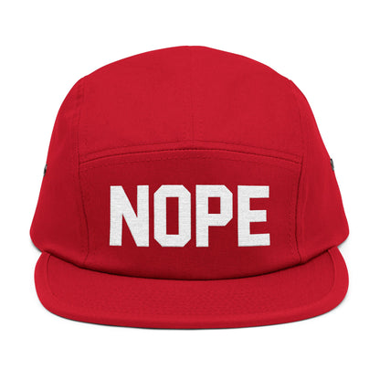 Red cap with 'NOPE' text on a white background. NOPE bold minimal typography embroidery design on cap. TEEZOCA