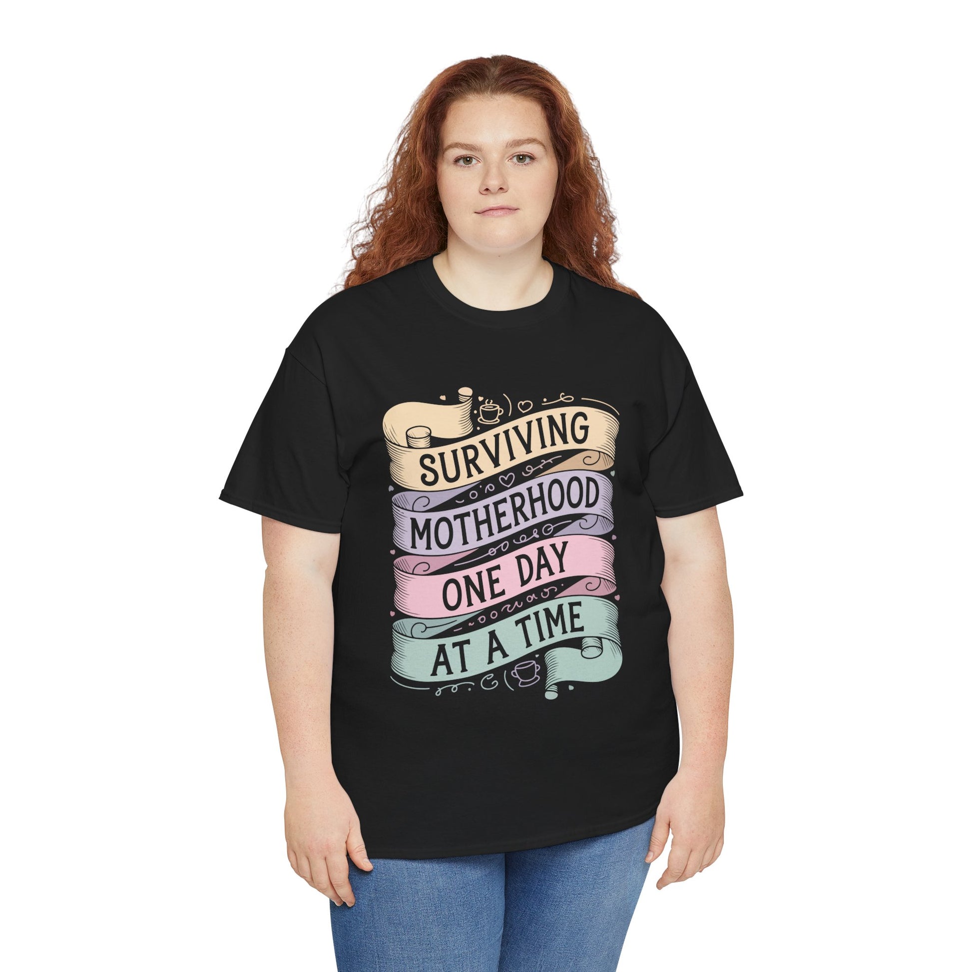 Women wearing a black TEEZOCA “Surviving Motherhood One Day At A Time” mom life t‑shirt.
