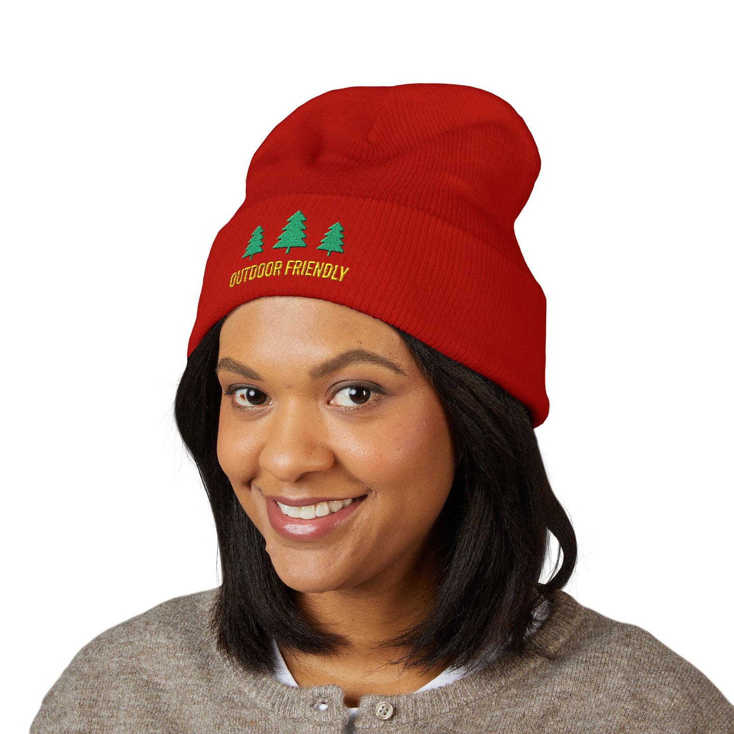 Person wearing a red beanie with 'Outdoor Friendly' text and tree graphics on a white background