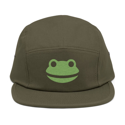 Green frog logo on a brown cap against a white background. Minimalist frog face embroidery design with wide smile and round eyes. TEEZOCA