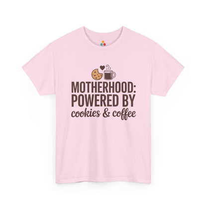 TEEZOCA light pink “Motherhood: Powered By Cookies & Coffee” cute mom graphic t‑shirt displayed flat.