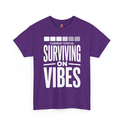 Purple t-shirt with white text 'CURRENT STATUS: Surviving on VIBES' on a white background | TEEZOCA