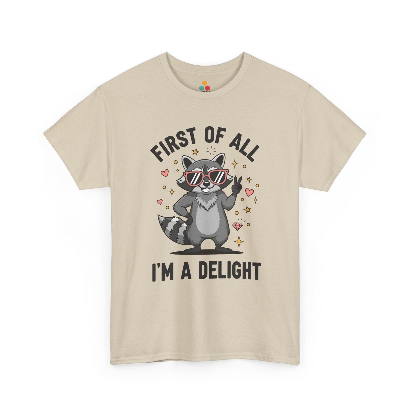 TEEZOCA beige “First Of All I’m A Delight” raccoon t‑shirt displayed flat.