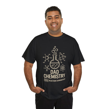 Smiling man wearing a TEEZOCA “Dad Chemistry 100% Reaction Guaranteed” funny science dad T‑shirt.