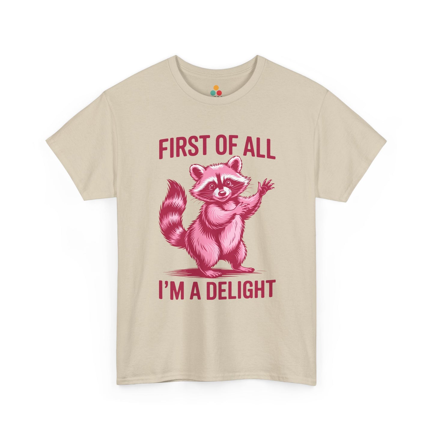 TEEZOCA beige “First Of All I’m A Delight” pink raccoon tee displayed flat.