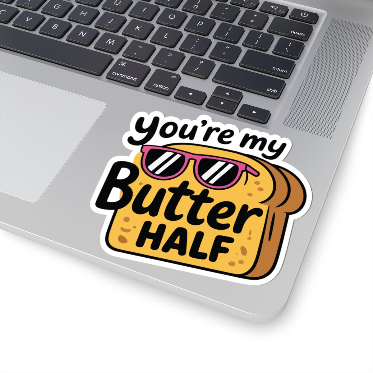 Laptop with a sticker reading 'You're my Butter Half' on the keyboard. TEEZOCA
