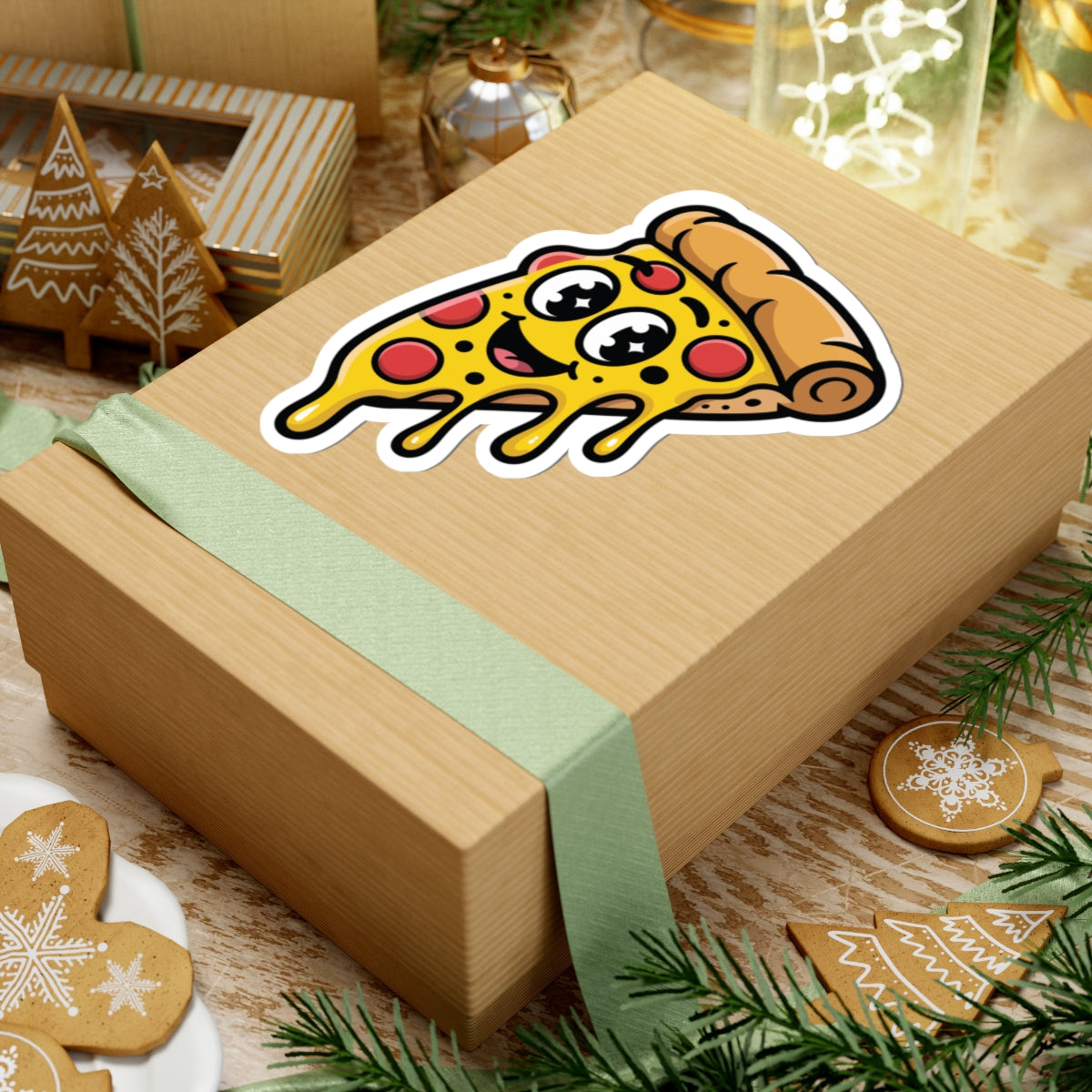 Wooden gift box with a pizza slice sticker on a festive background with cookies and lights. TEEZOCA