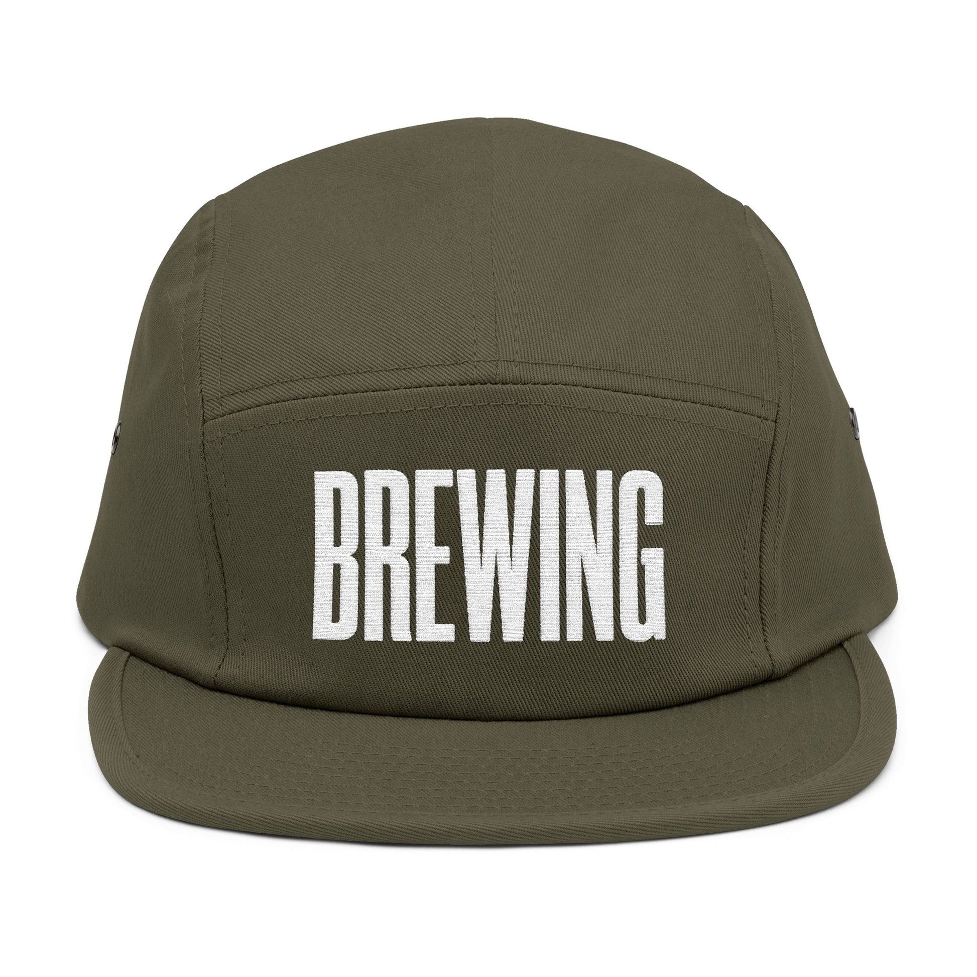 Green cap with 'BREWING' text on a white background. BREWING minimalist text embroidery design on 5-panel cap. TEEZOCA
