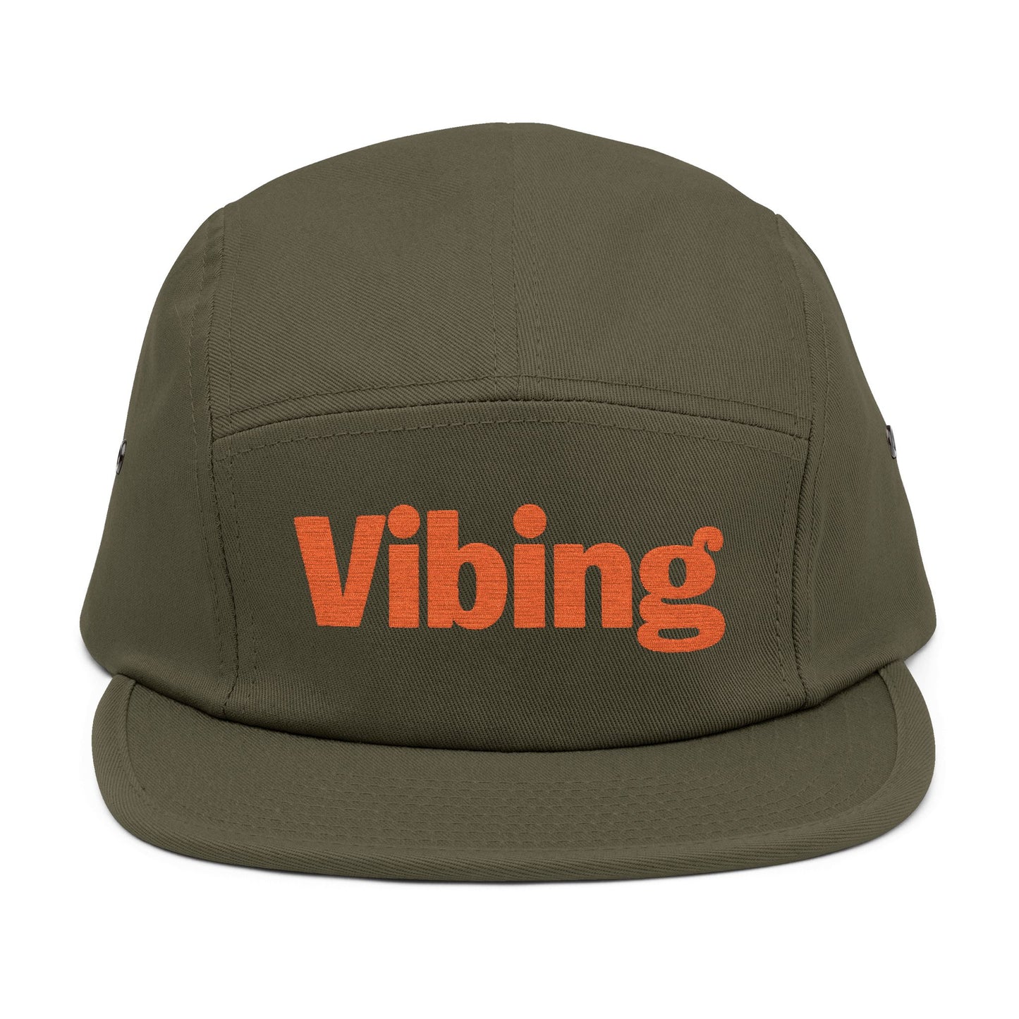 Green cap with 'Vibing' text in orange on a white background. Vibing embroidered text design on minimalist 5-panel cap. TEEZOCA