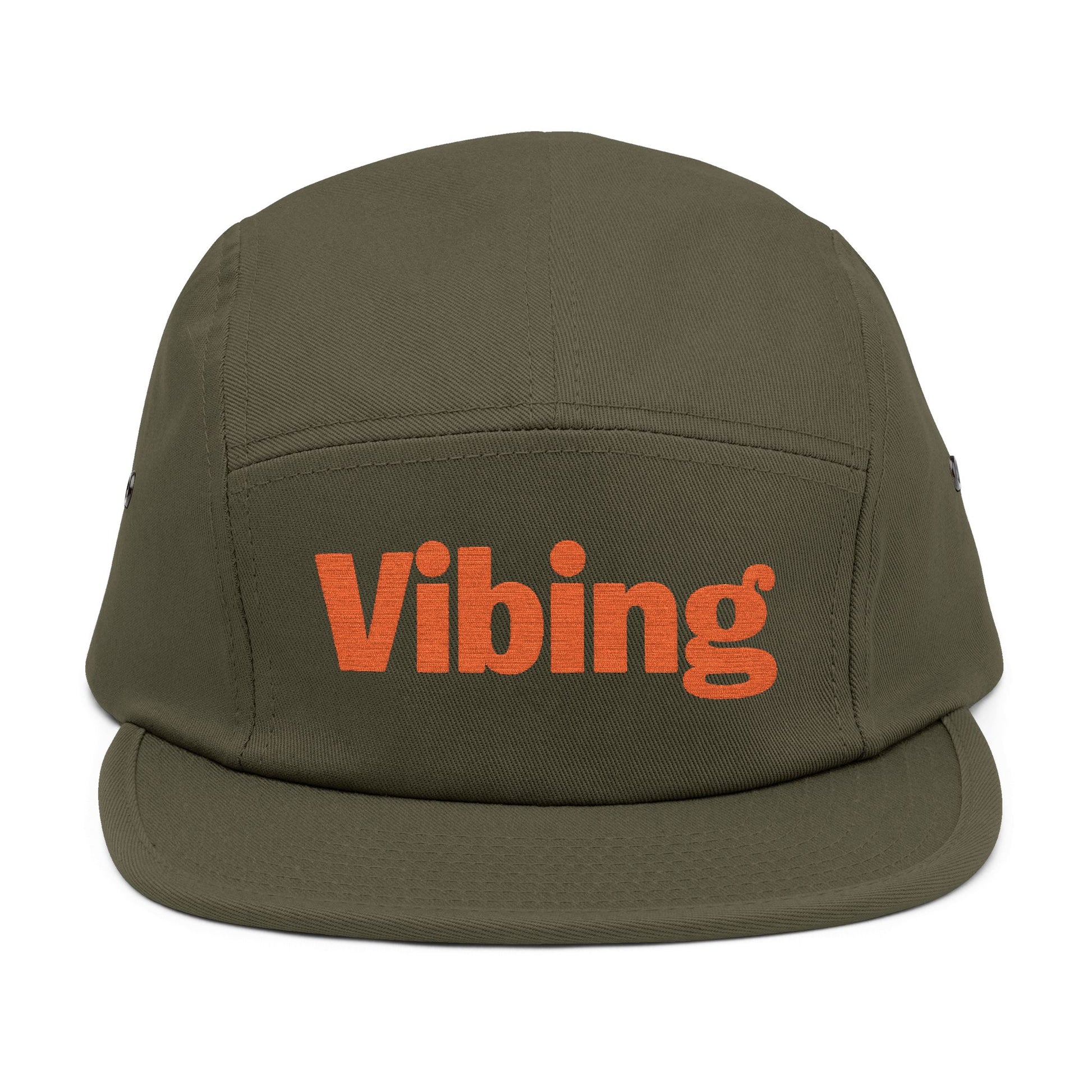 Green cap with 'Vibing' text in orange on a white background. Vibing embroidered text design on minimalist 5-panel cap. TEEZOCA