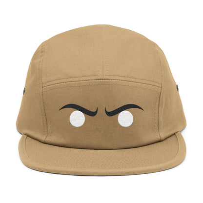 Tan cap with cartoonish eyes on a white background. Stylized angry expression graphic optimized for embroidery. TEEZOCA