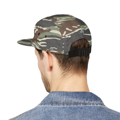 Camouflage cap worn by a person on a white background. TIRED minimalist text embroidered on 5-panel cap by TEEZOCA