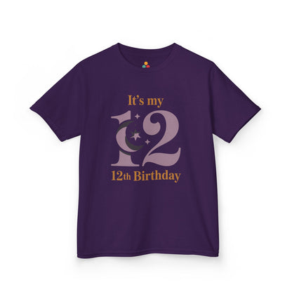  Purple kids’ t‑shirt with mauve “12” moon and stars graphic and gold “It’s my 12th Birthday” text, flat front view.
