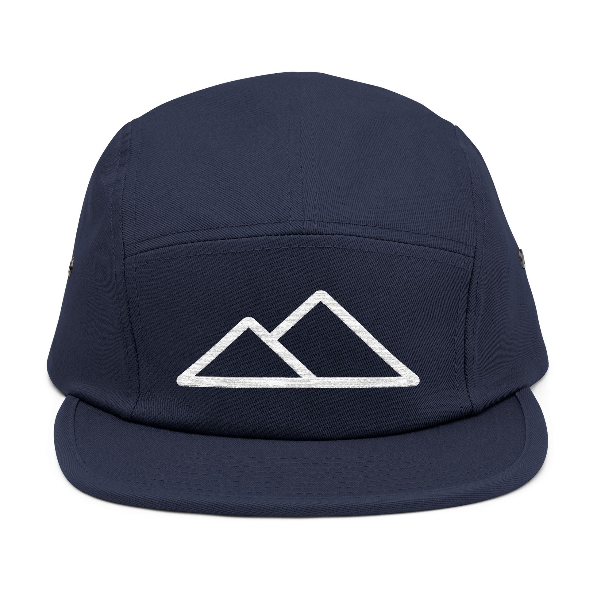 Navy blue cap with white mountain logo on a white background. Minimal mountain outline design embroidered on a 5-panel cap. TEEZOCA