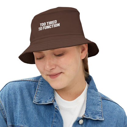 Funny brown bucket hat with 'Too Tired to Function' text on a white background. TEEZOCA