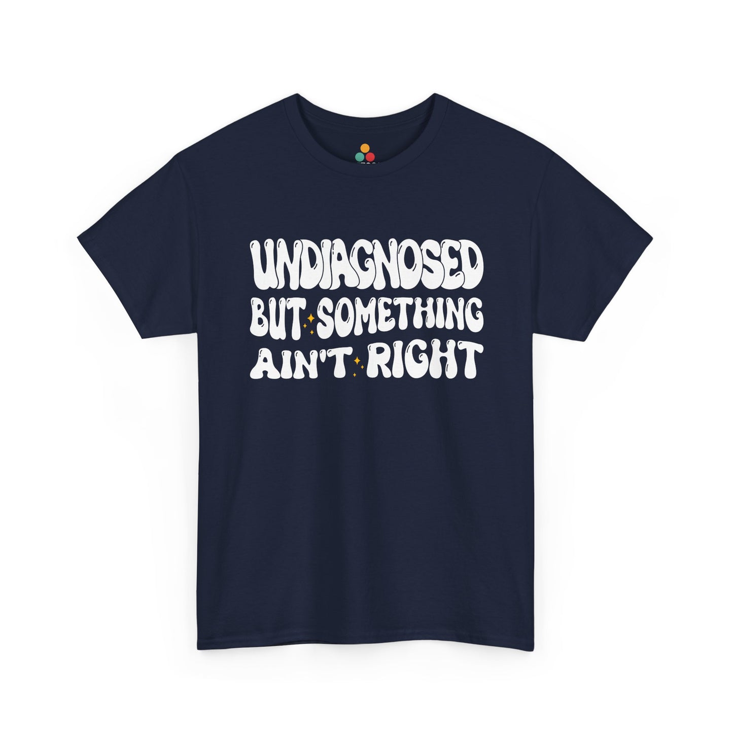 “Teezoca Undiagnosed But Something Ain’t Right shirt, retro white lettering mental health humor graphic, navy blue tee, flat lay.”​

