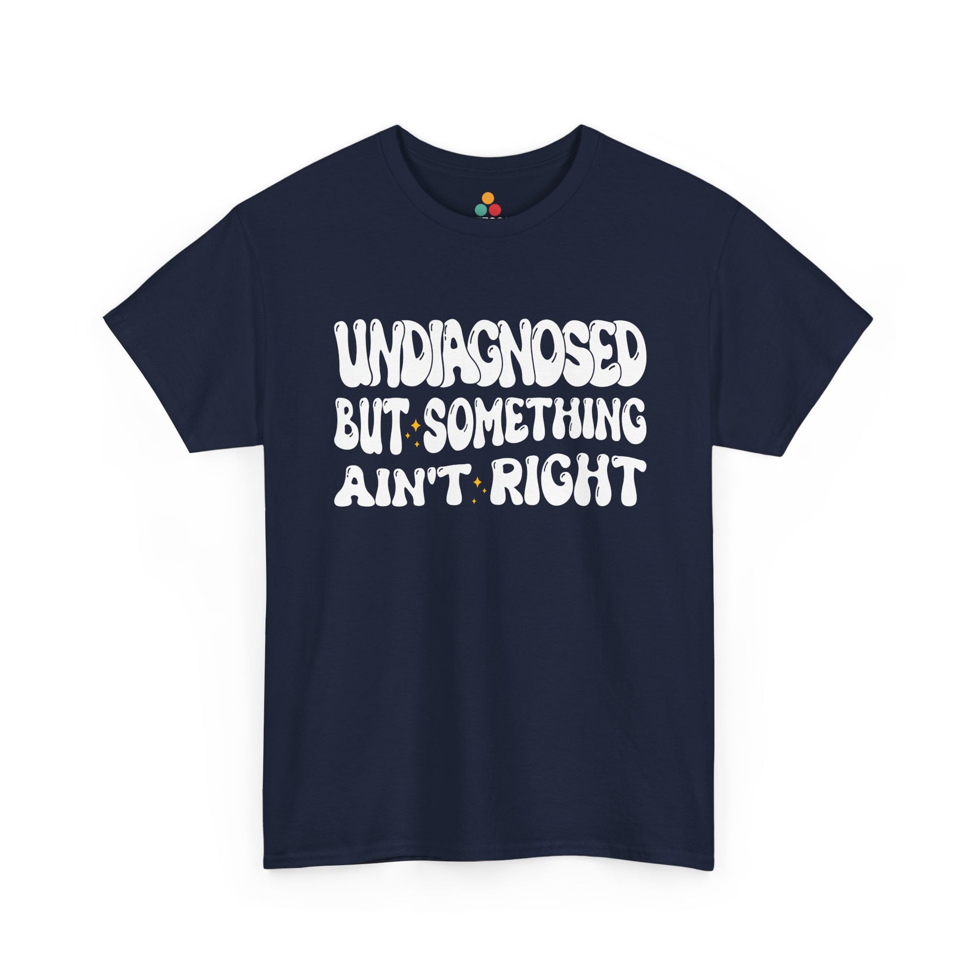 “Teezoca Undiagnosed But Something Ain’t Right shirt, retro white lettering mental health humor graphic, navy blue tee, flat lay.”​

