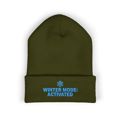 Green beanie with 'Winter Mode: Activated' text on a white background. Winter Mode Activated embroidered snowflake beanie in soft acrylic knit