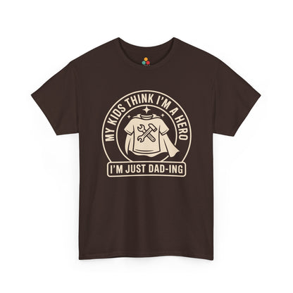 TEEZOCA brown “My Kids Think I’m A Hero I’m Just Dad‑ing” graphic dad T‑shirt shown flat.