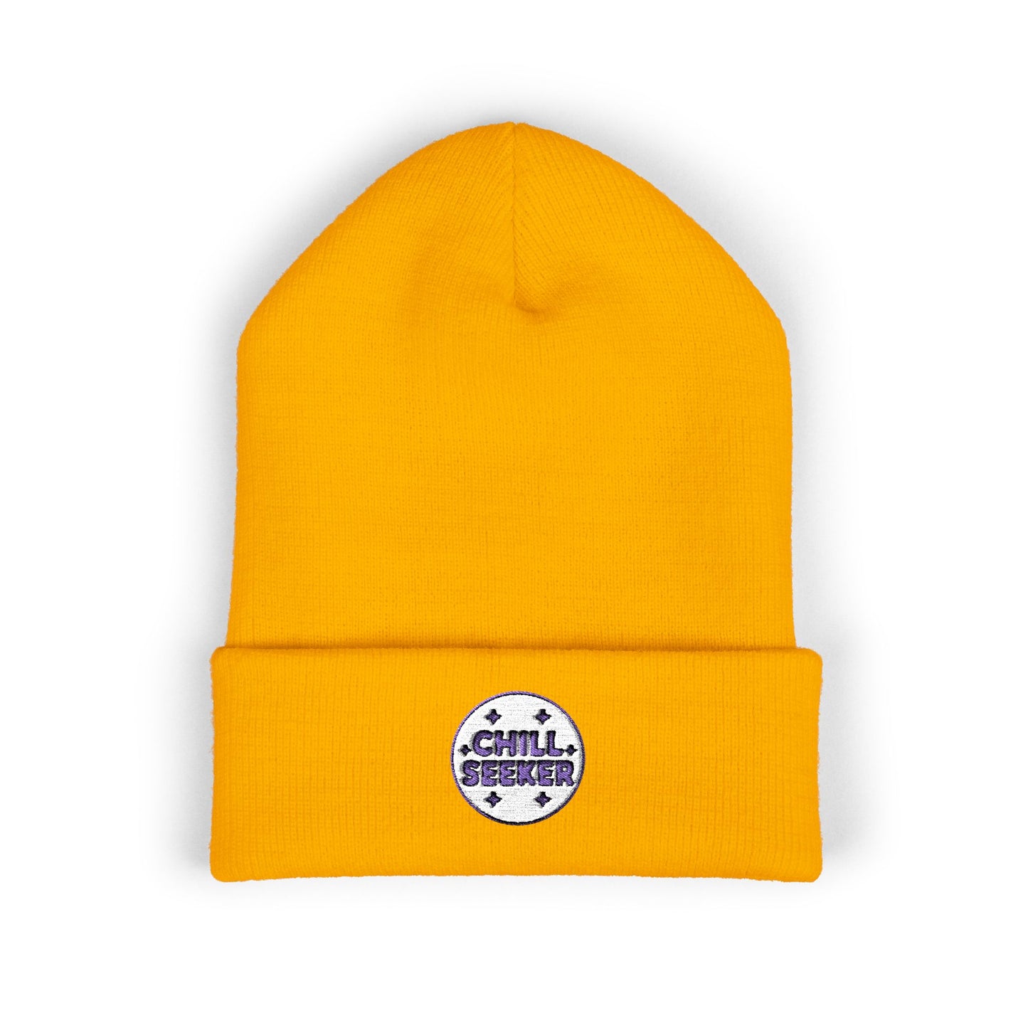 Yellow beanie with a 'Chill Seeker' patch on a white background