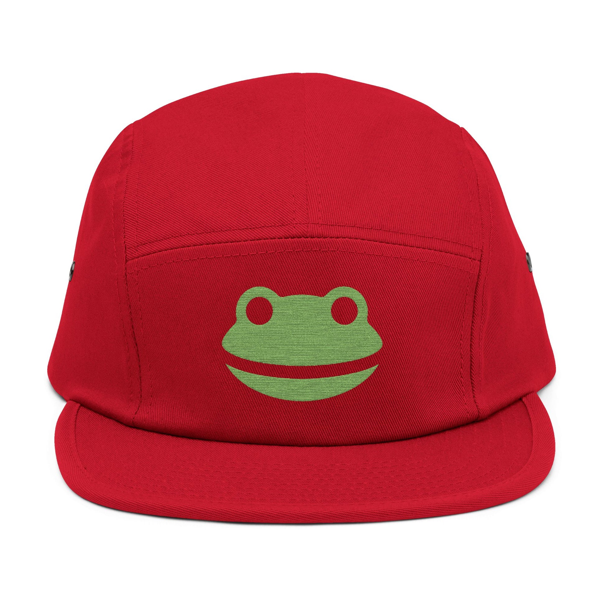 Red cap with a green frog logo on a white background. Minimalist frog face embroidery design with wide smile and round eyes. TEEZOCA