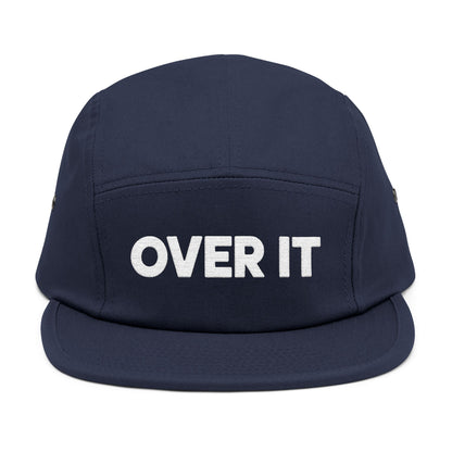 Navy blue cap with 'OVER IT' text on a white background. OVER IT embroidered text design displayed on clean white typography. TEEZOCA