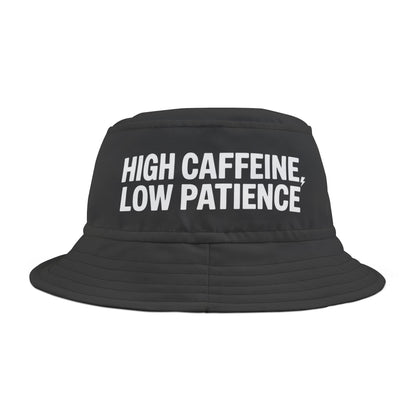 Black bucket hat with Funny 'HIGH CAFFEINE, LOW PATIENCE' text on a white background. TEEZOCA