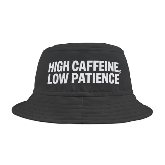 Black bucket hat with Funny 'HIGH CAFFEINE, LOW PATIENCE' text on a white background. TEEZOCA