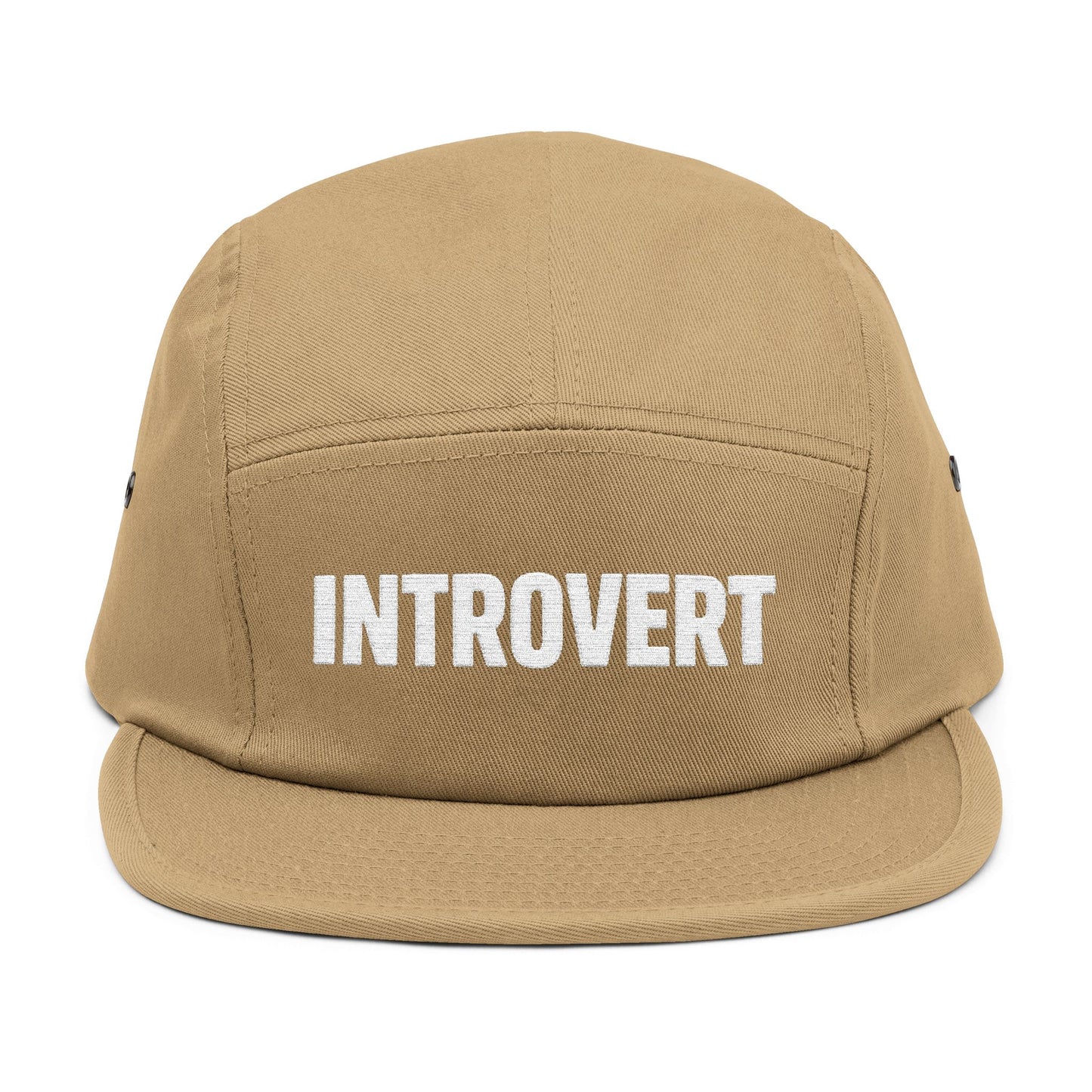 Tan cap with 'INTROVERT' text on a white background. Close-up of the “INTROVERT” embroidery designed for 5-panel caps. TEEZOCA