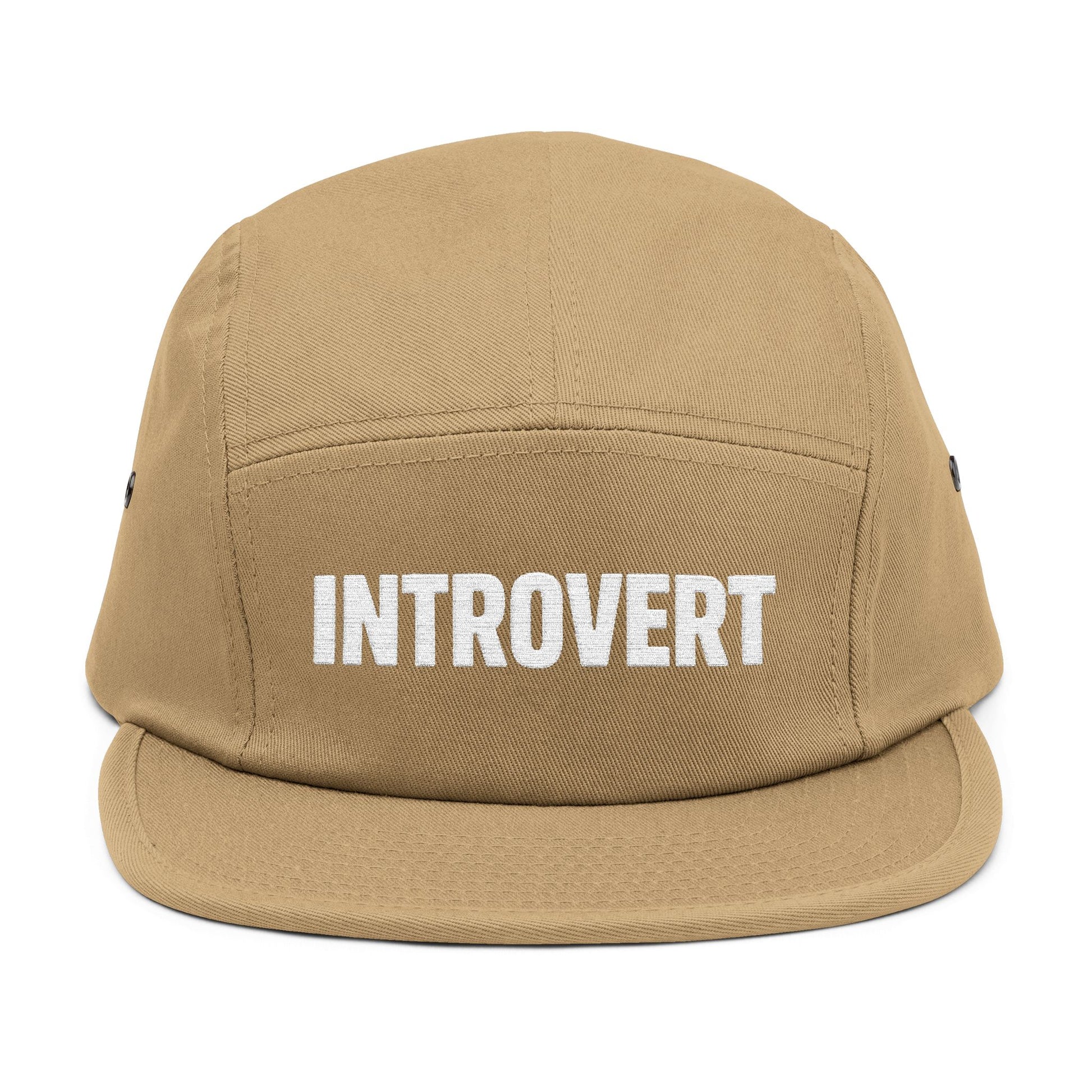Tan cap with 'INTROVERT' text on a white background. Close-up of the “INTROVERT” embroidery designed for 5-panel caps. TEEZOCA