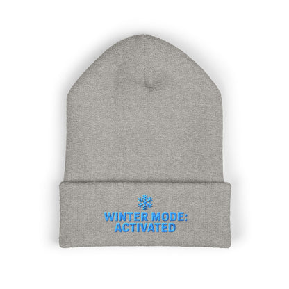 Gray beanie with 'Winter Mode: Activated' text on a white background. Cozy embroidered beanie featuring Winter Mode Activated design