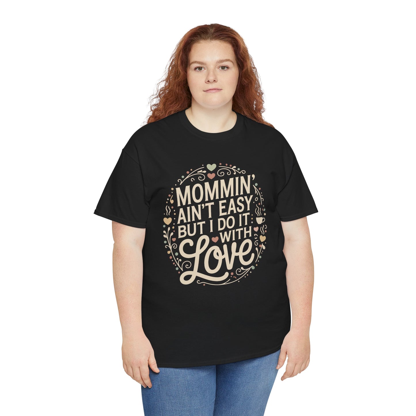 Woman wearing a black TEEZOCA “Mommin’ Ain’t Easy But I Do It With Love” cute mom life t‑shirt.