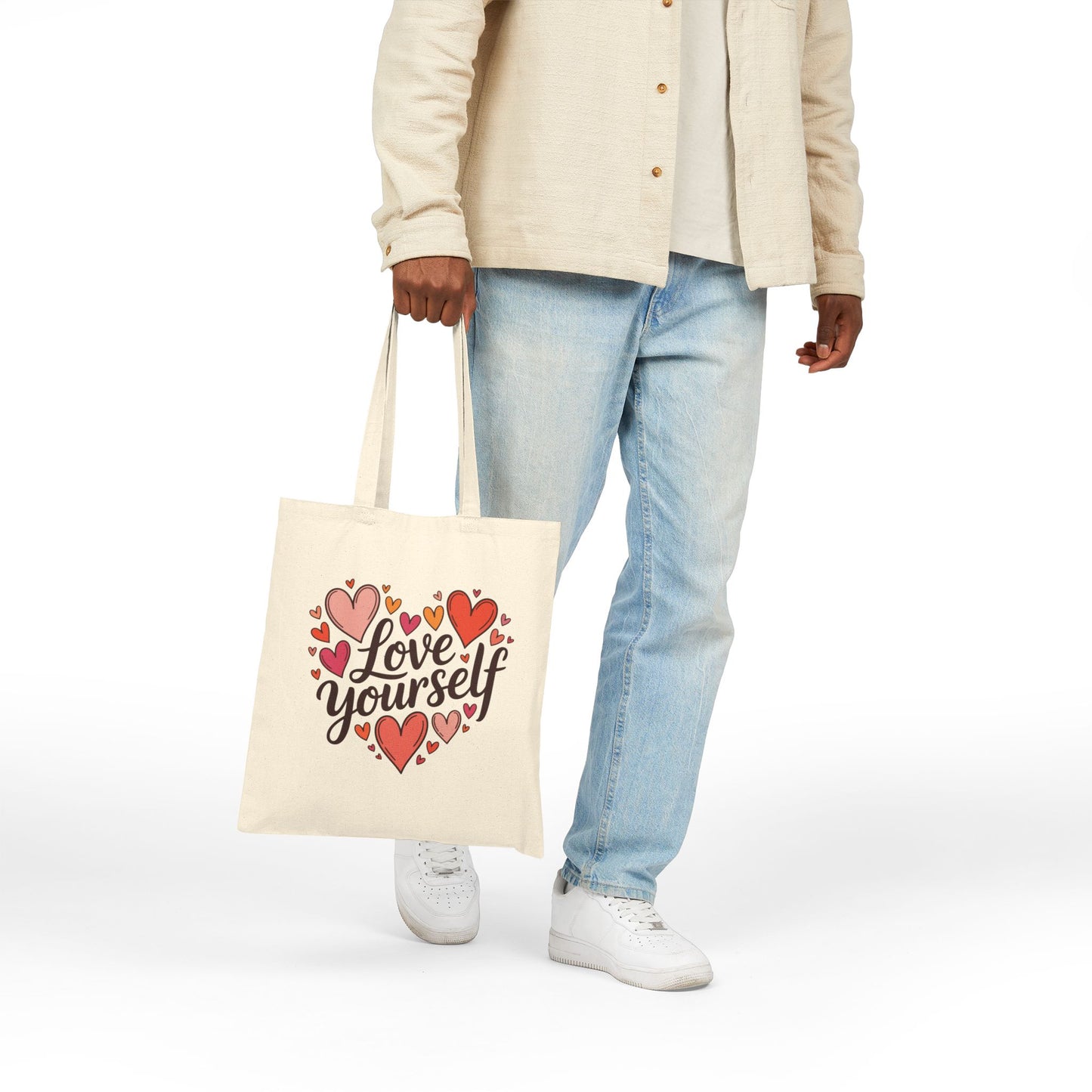 Positive affirmation Love Yourself heart design displayed on a TEEZOCA tote bag