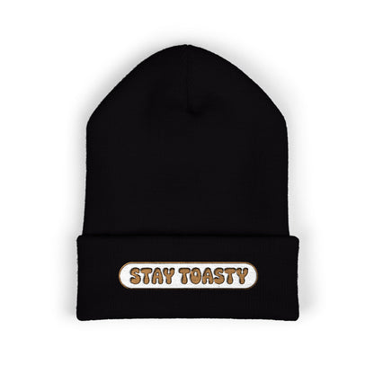 Black beanie with 'Stay Toasty' text on a white background