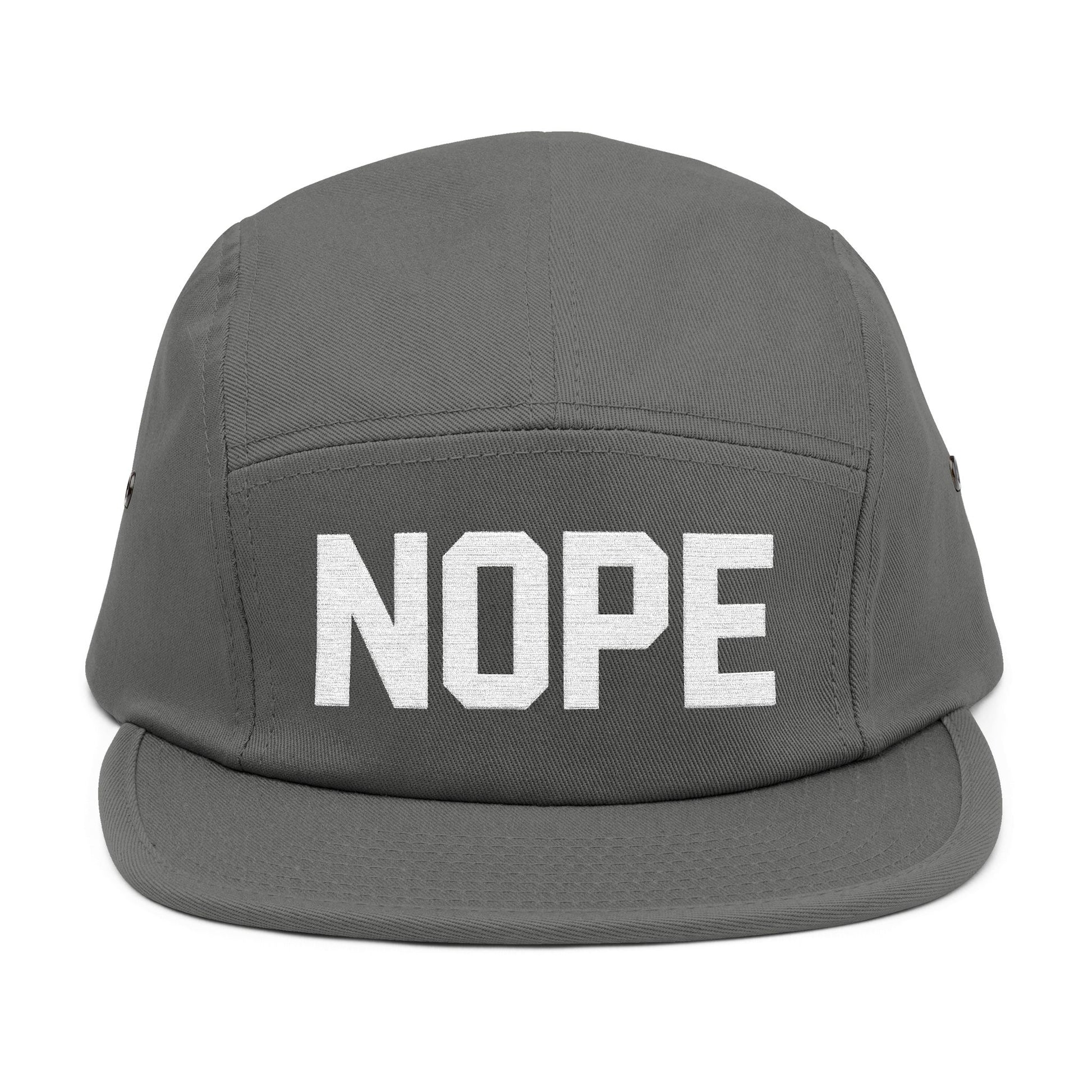 Gray cap with 'NOPE' text on a white background. NOPE bold minimal typography embroidery design on cap. TEEZOCA