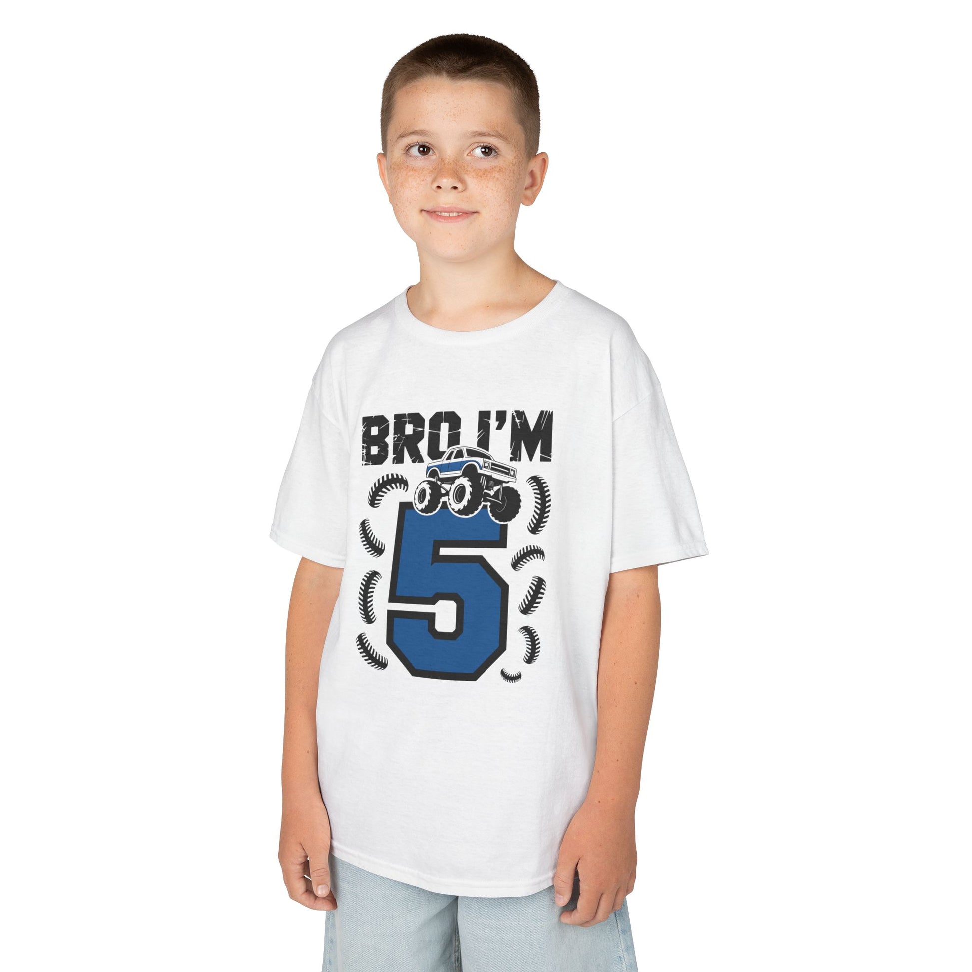 Child wearing a white t-shirt with a blue number 5 and text on a white   kids' t‑shirt with "Bro I'm 5" dirt bike motorcycle graphic in blue and black, flat front viewbackground
