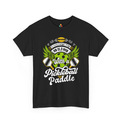“Teezoca Never Underestimate an Old Man with a Pickleball Paddle shirt, winged green pickleball and crossed paddles graphic, black tee, front view.”

