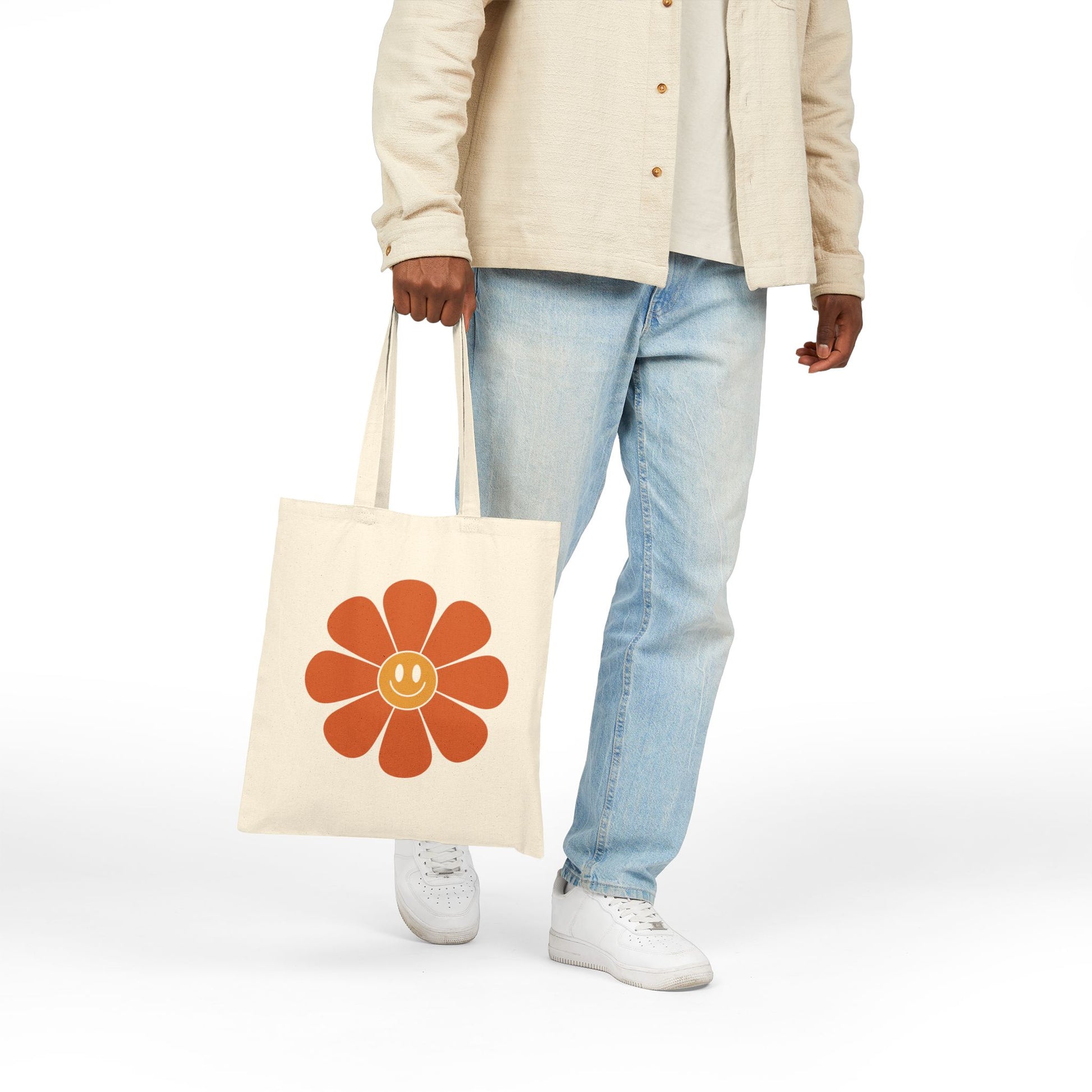 Vintage-style smiley flower artwork on a TEEZOCA tote bag