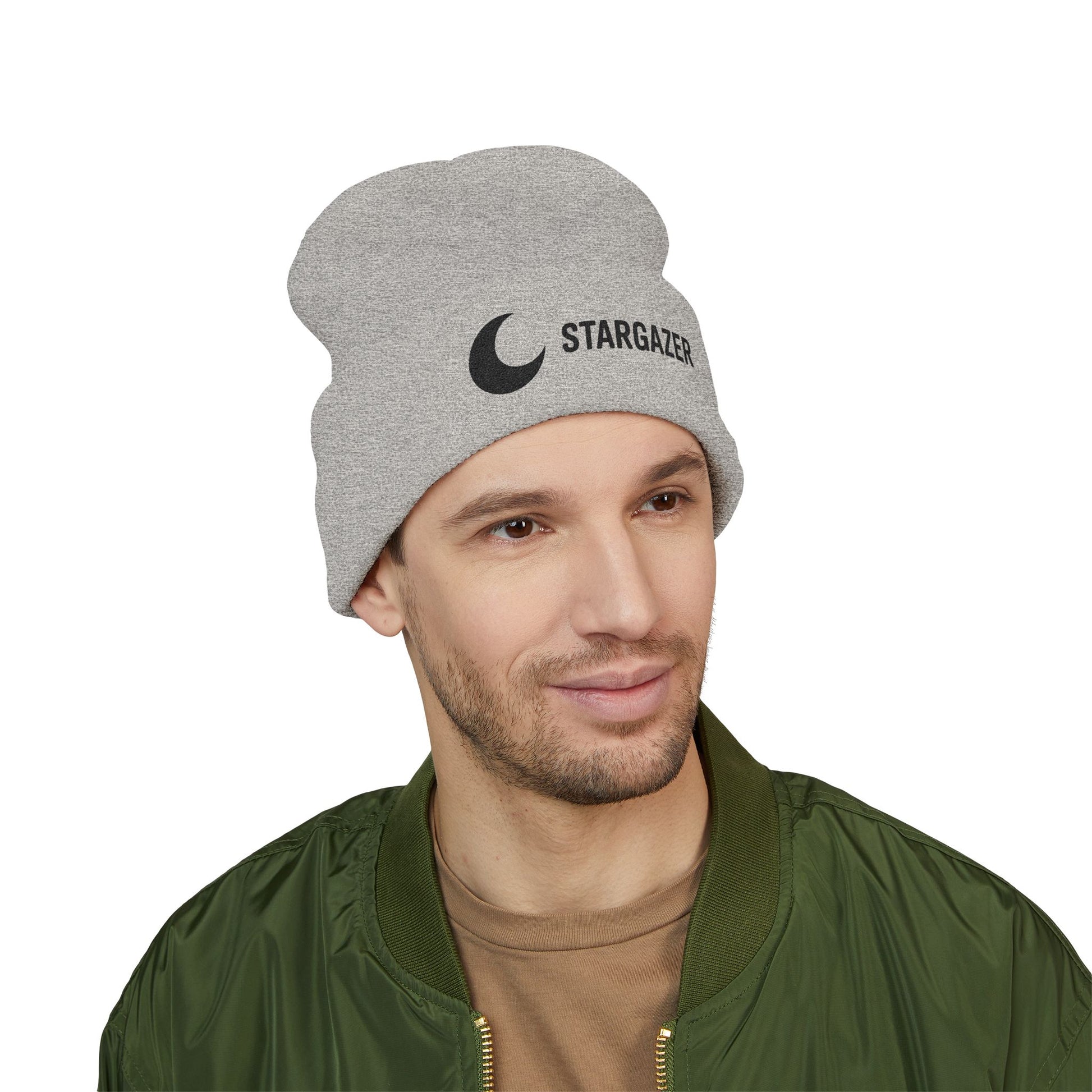Man wearing a gray beanie with 'Stargazer' text and logo on a white background