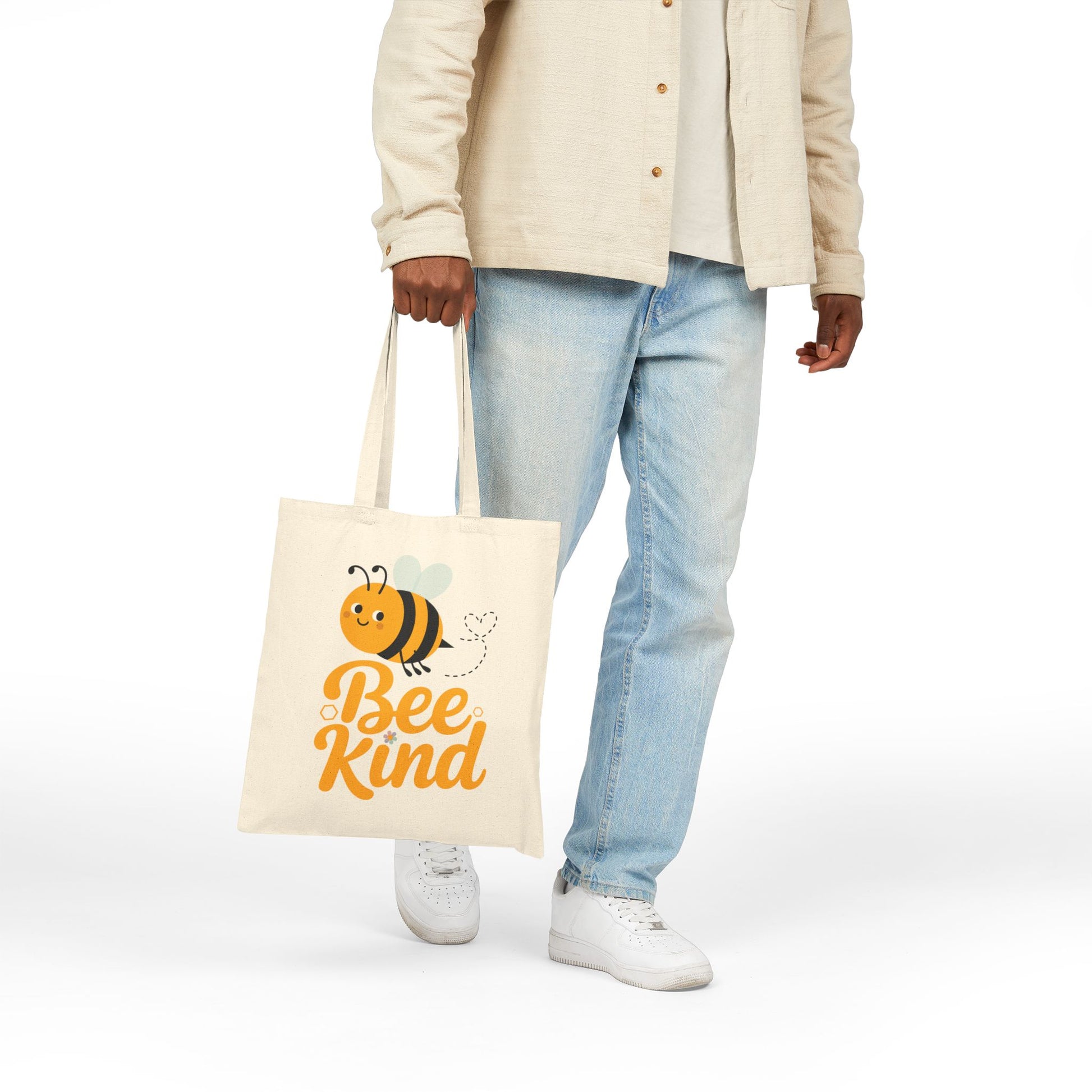 Positive quote Bee Kind displayed with a playful bee graphic on a TEEZOCA tote bag