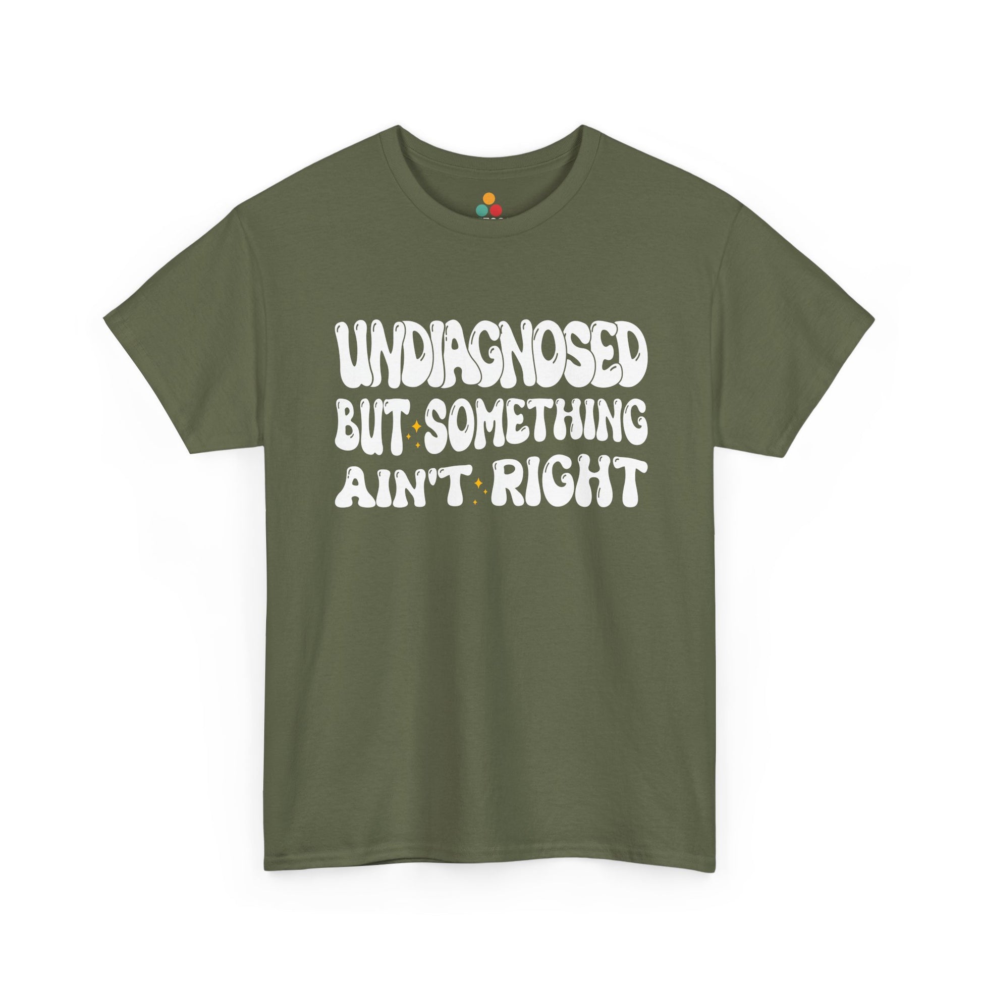 “Teezoca Undiagnosed But Something Ain’t Right shirt, groovy white text design, olive green tee, laid flat.”​

