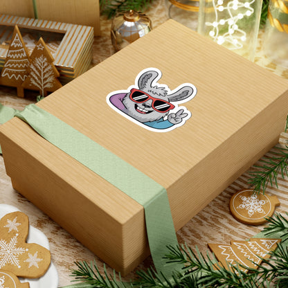 Wooden gift box with a cartoon bunny sticker on a festive background with cookies and lights. TEEZOCA