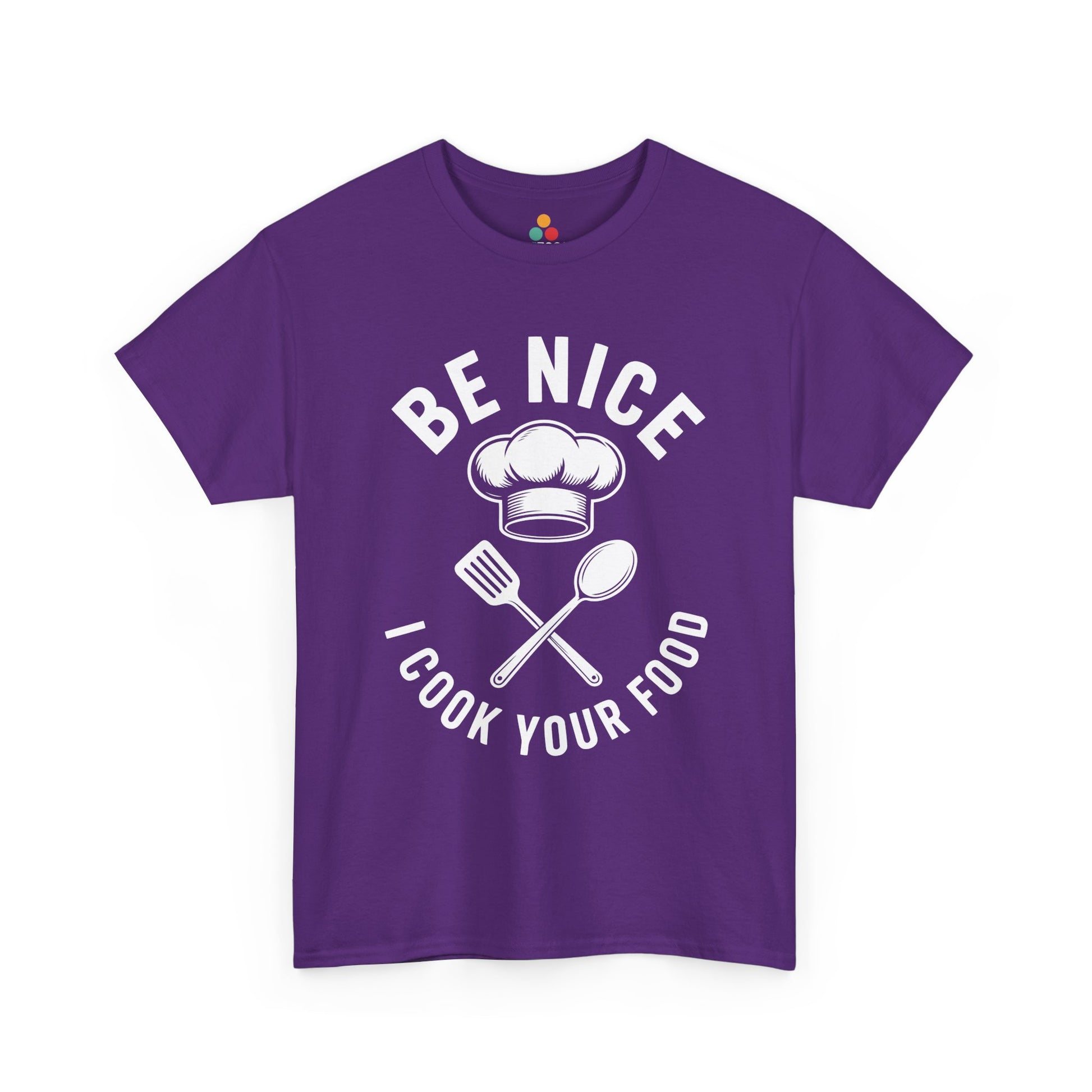 “Teezoca Be Nice I Cook Your Food shirt, chef hat and utensils graphic, purple tee, flat front display.”

