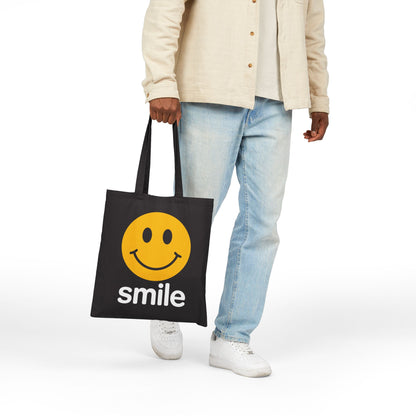 Positive smile-themed illustration with bold yellow circle on a TEEZOCA tote bag