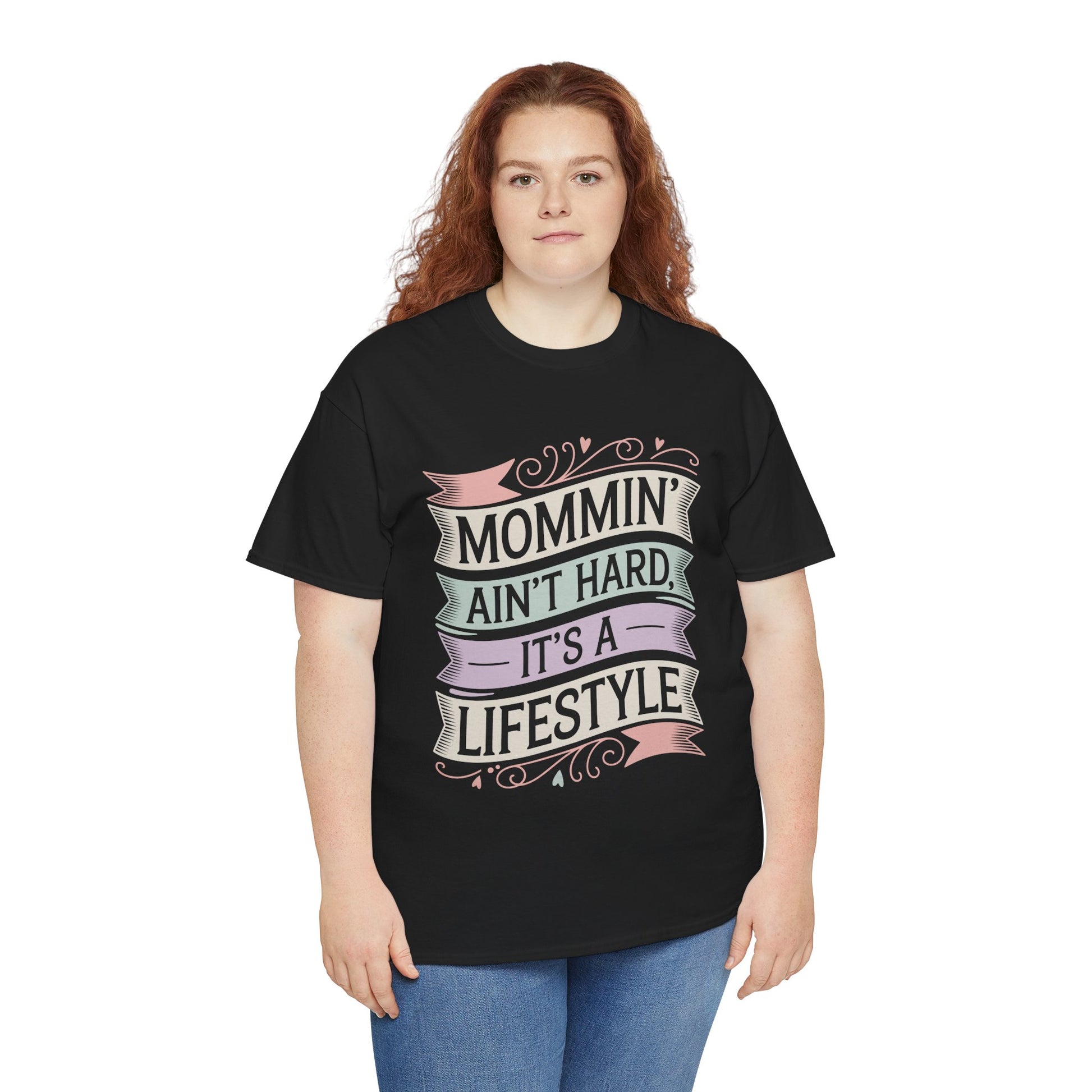 Woman wearing a black TEEZOCA “Mommin’ Ain’t Hard, It’s A Lifestyle” cute mom life t‑shirt.
