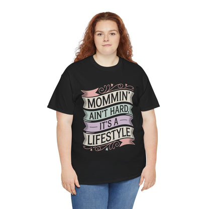 Woman wearing a black TEEZOCA “Mommin’ Ain’t Hard, It’s A Lifestyle” cute mom life t‑shirt.