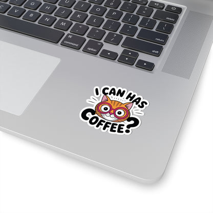 Laptop with a sticker of a cat wearing glasses and the text 'I can has coffee?' on a white background. TEEZOCA